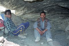 09 Guide Iqbal And Porter Hayder Khan Rest In a Cave Between Korophon And Jhola.jpg